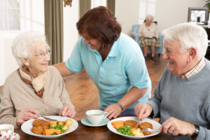 caregiver preparing food for the patient
